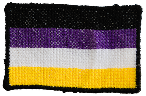 Handmade cross stitched nonbinary flag patch by Frances Cardinale