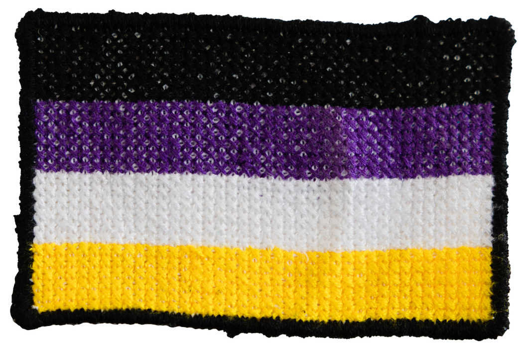 Handmade cross stitched nonbinary flag patch by Frances Cardinale